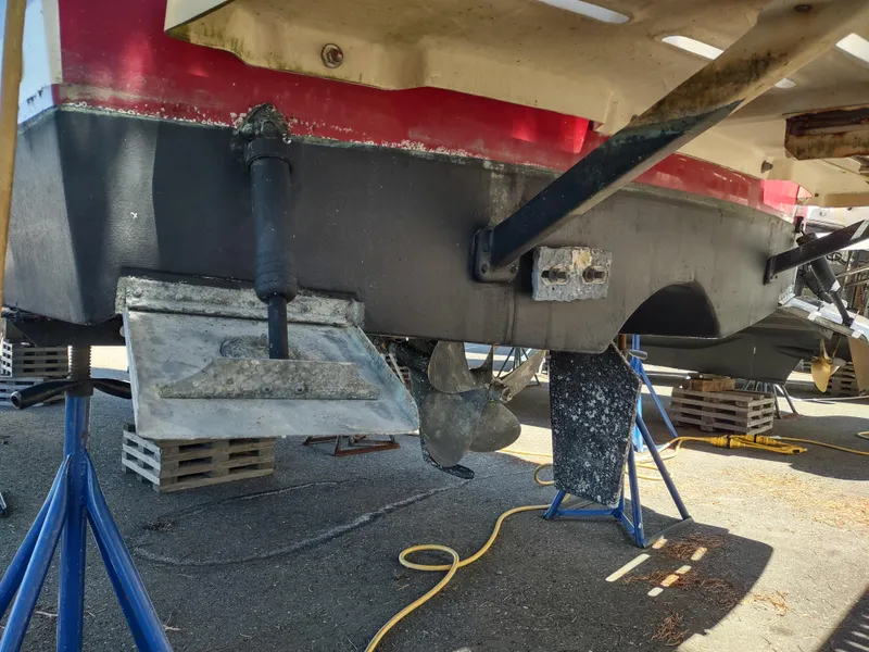 Slide: The Image of 2008 Mainship 30 Pilot II Sedan boat on stands, showing propeller and rudder. - 47