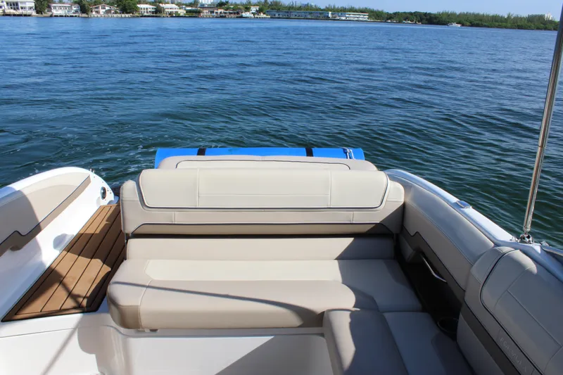 Slide: The Image of 2019 Formula 270 Bowrider boat with spacious seating on a calm lake. - 15