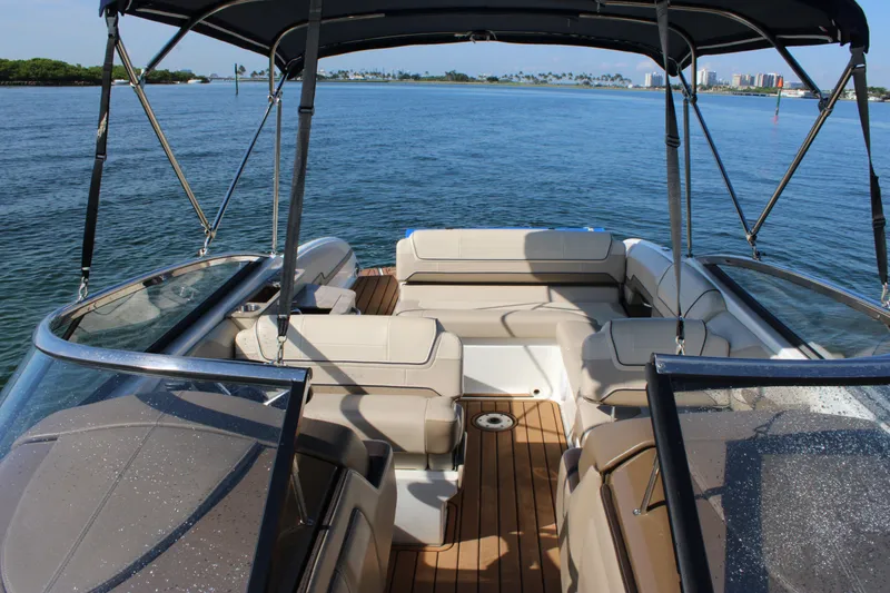 Slide: The Image of 2019 Formula 270 Bowrider boat with spacious seating on calm water. - 18