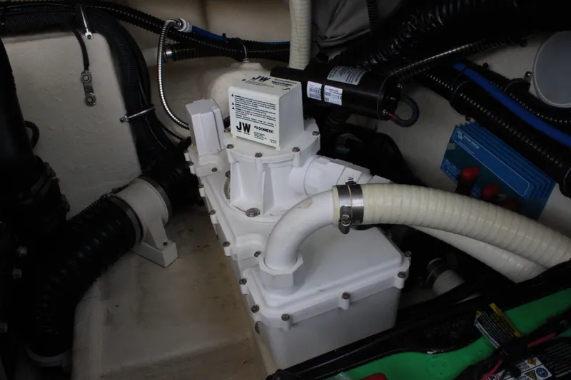 Slide: The Image of Engine compartment of 2019 Formula 270 Bowrider with pump and hoses. - 24