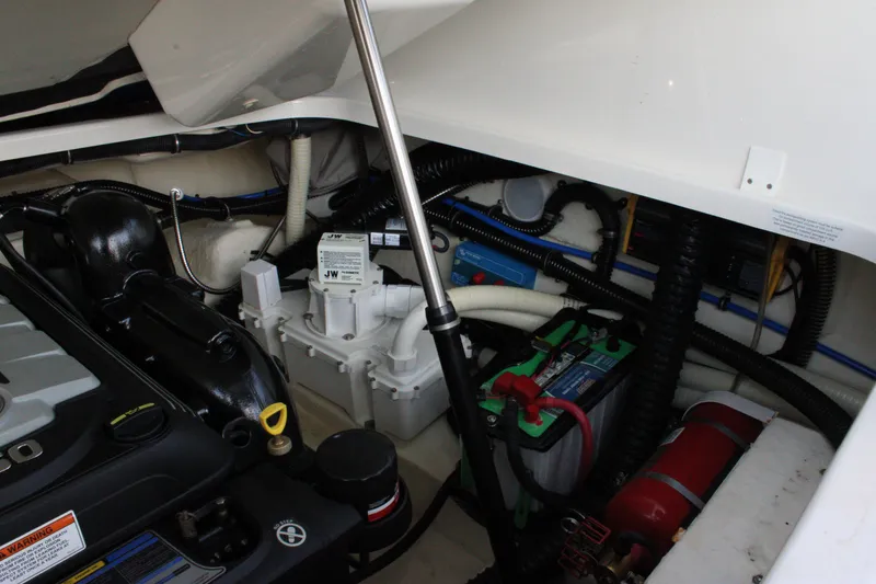 Slide: The Image of Engine compartment of a 2019 Formula 270 Bowrider with visible battery and fire extinguisher. - 25