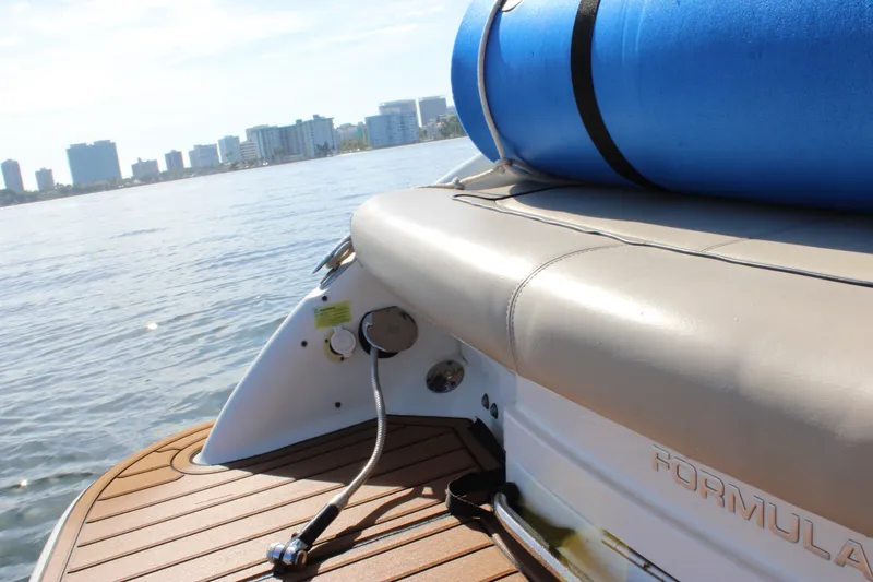 Slide: The Image of 2019 Formula 270 Bowrider boat with city skyline in the background. - 8