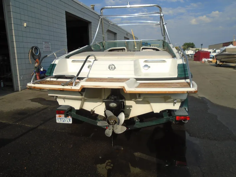 Slide: The Image of 1994 Mariah 211 Shabah boat, rear view, parked outdoors. - 3