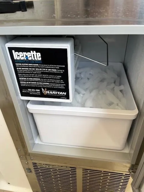 Slide: The Image of Ice maker in 2000 Sea Ray Cruiser 310 Sundancer, filled with ice cubes. - 17