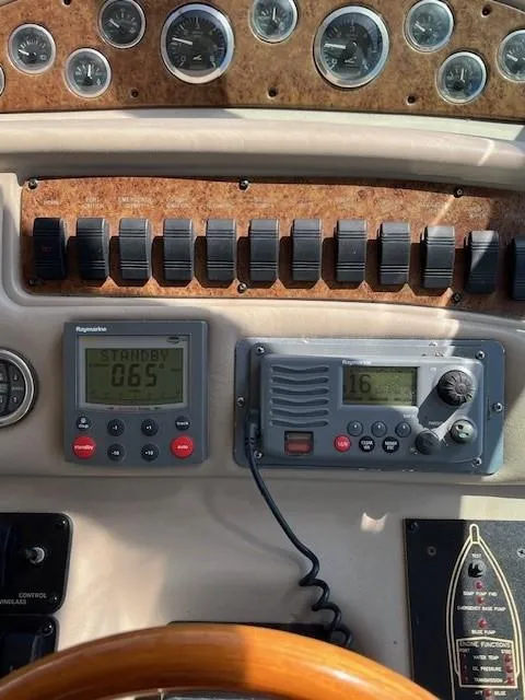 Slide: The Image of Control panel of 2000 Sea Ray Cruiser 310 Sundancer with navigation instruments. - 18