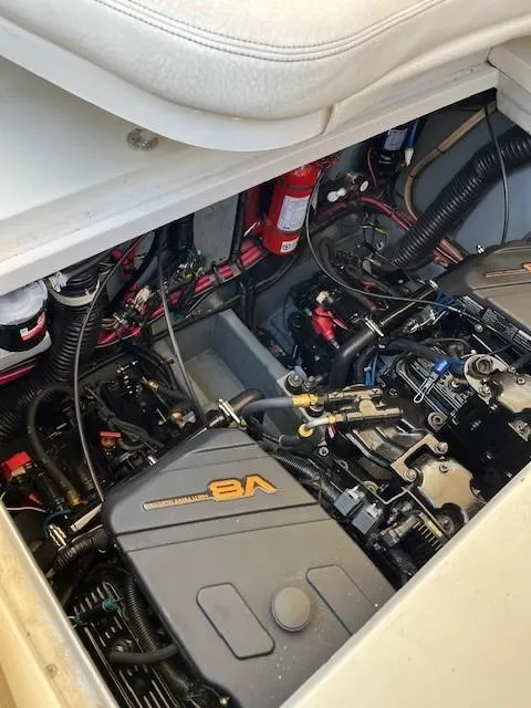 Slide: The Image of Engine compartment of 2000 Sea Ray Cruiser 310 Sundancer with V8 engine. - 22
