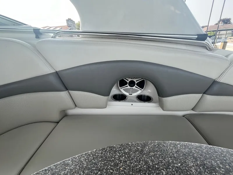 Slide: The Image of 2010 Chaparral 275 SSi boat interior with gray seating and speaker system. - 16