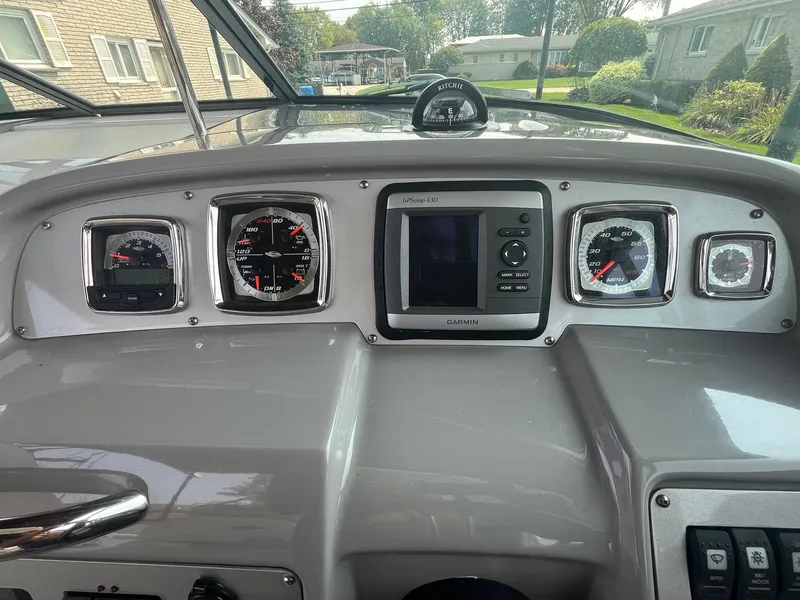 Slide: The Image of Dashboard of a 2010 Chaparral 275 SSi boat with gauges and navigation system. - 21