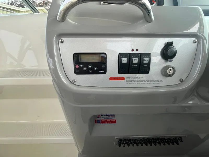 Slide: The Image of Control panel of 2010 Chaparral 275 SSi boat with switches and ignition. - 22