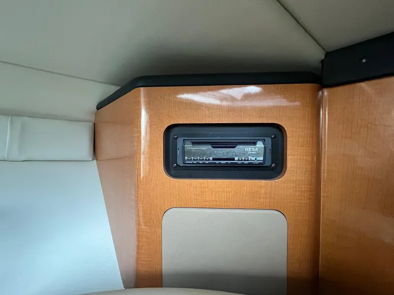 Slide: The Image of Interior of 2010 Chaparral 275 SSi boat featuring a built-in stereo system. - 28
