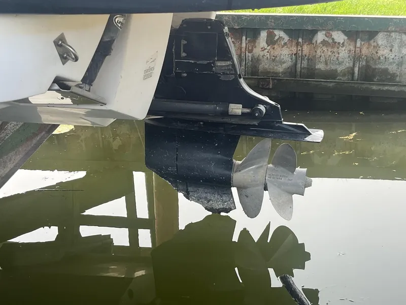 Slide: The Image of 2010 Chaparral 275 SSi boat propeller and stern drive in water. - 31