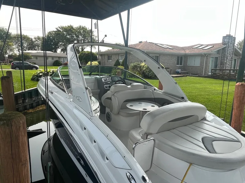 Slide: The Image of 2010 Chaparral 275 SSi boat docked near a residential area. - 7