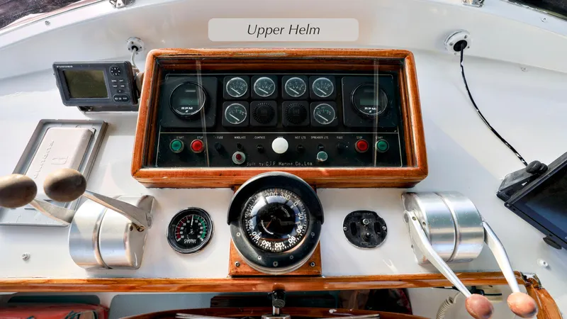 Slide: The Image of Upper helm of 1988 DeFever Pilot House with navigation instruments and controls. - 22