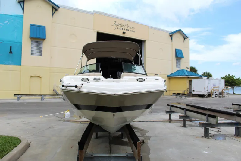 Slide: The Image of 2017 NauticStar 243DC Sport Deck boat at marina dock. - 11