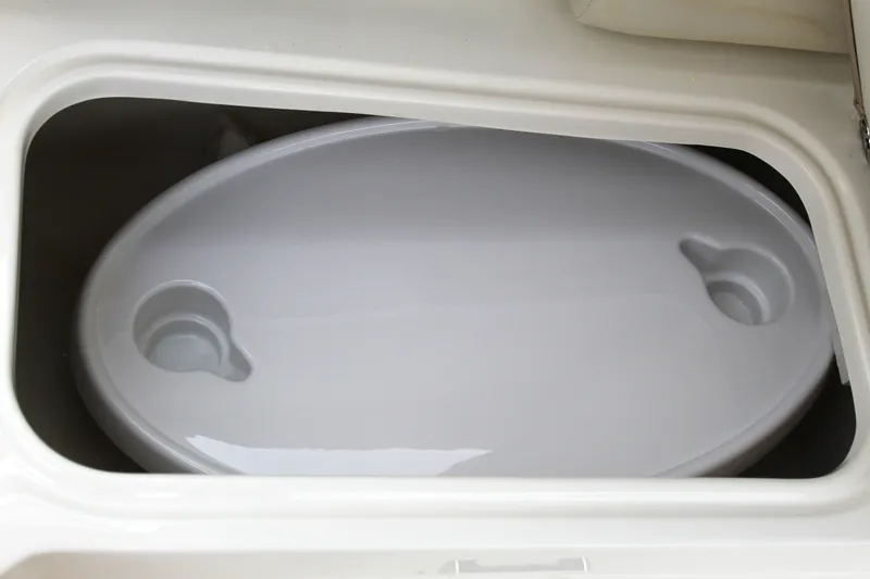 Slide: The Image of Storage compartment in 2017 NauticStar 243DC Sport Deck boat. - 28