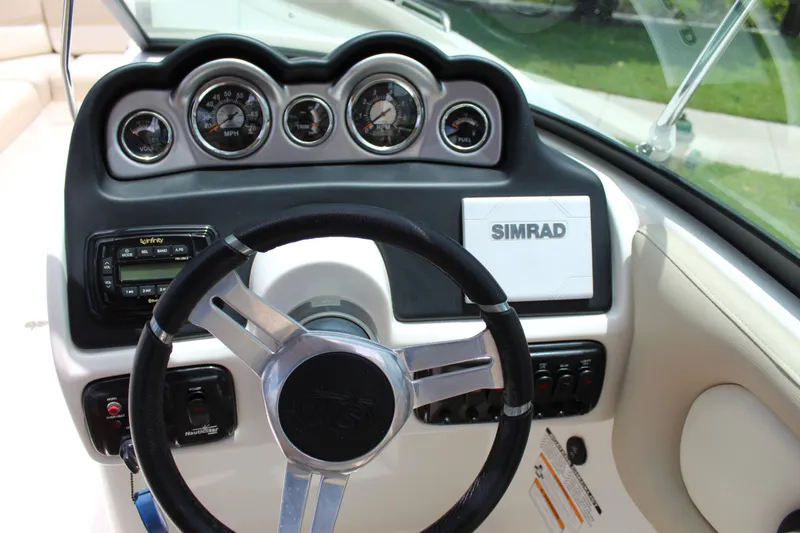 Slide: The Image of 2017 NauticStar 243DC Sport Deck dashboard with Simrad display and gauges. - 32