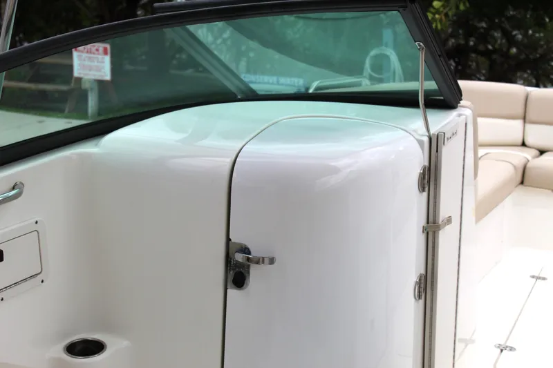 Slide: The Image of 2017 NauticStar 243DC Sport Deck boat interior with seating and storage compartment. - 37