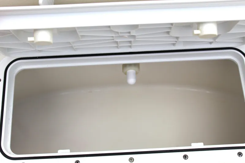 Slide: The Image of Open storage compartment in 2017 NauticStar 243DC Sport Deck boat. - 40