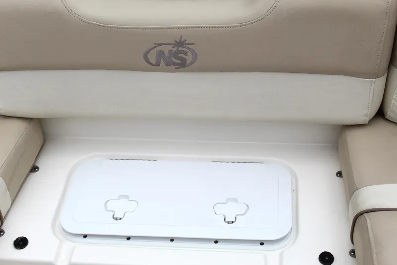 Slide: The Image of 2017 NauticStar 243DC Sport Deck seating with storage compartment. - 43