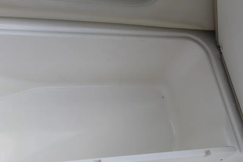 Slide: The Image of Interior storage compartment of 2017 NauticStar 243DC Sport Deck boat. - 45