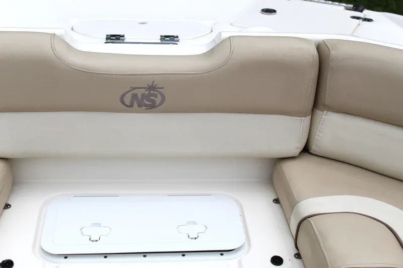 Slide: The Image of 2017 NauticStar 243DC Sport Deck boat seating with storage compartment. - 46