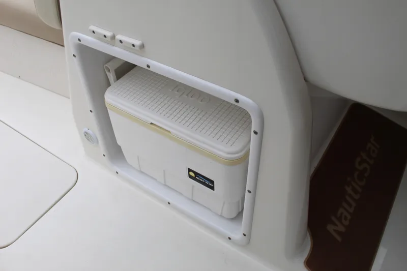 Slide: The Image of 2017 NauticStar 243DC Sport Deck with built-in cooler storage compartment. - 7