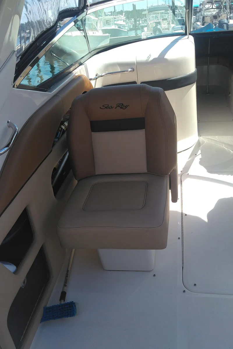 Slide: The Image of 2014 Sea Ray 300 SLX interior with beige seating and sleek design. - 13