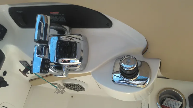 Slide: The Image of Close-up of 2014 Sea Ray 300 SLX boat controls and throttle. - 16