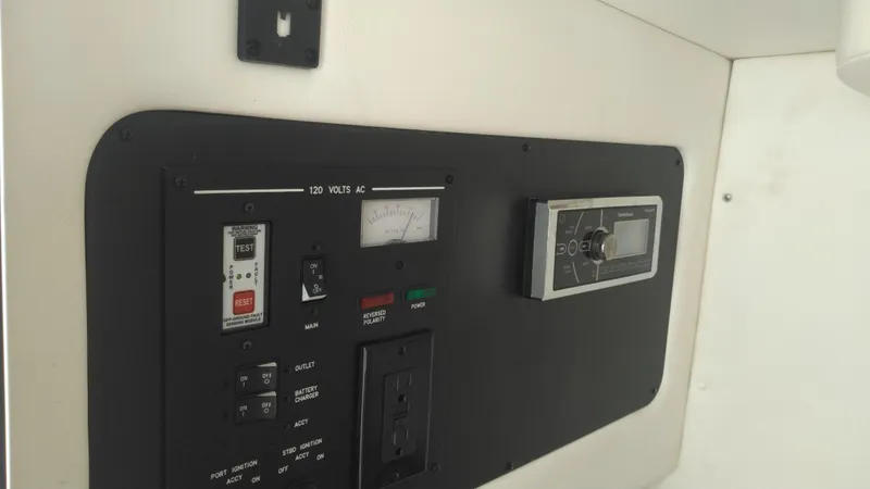 Slide: The Image of Control panel of a 2014 Sea Ray 300 SLX boat, featuring switches and gauges. - 18