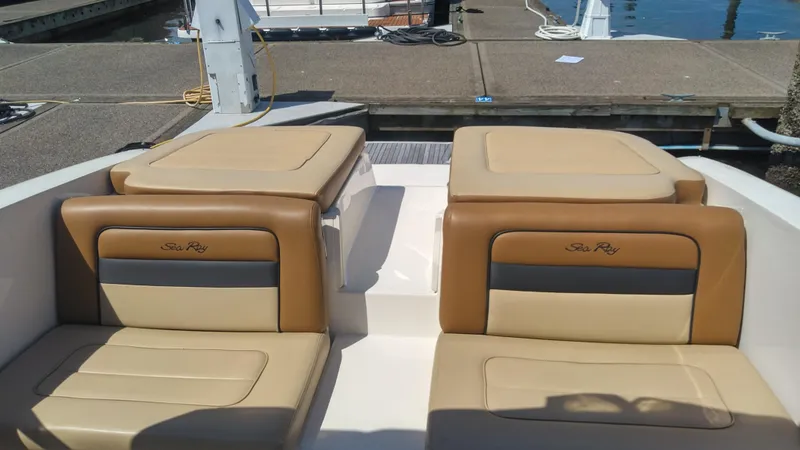 Slide: The Image of 2014 Sea Ray 300 SLX boat with tan leather seats at a dock. - 21