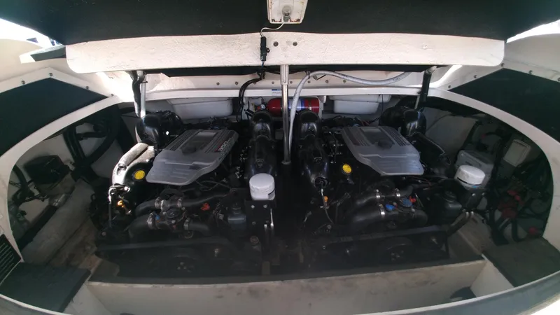 Slide: The Image of 2014 Sea Ray 300 SLX engine compartment with dual engines. - 22