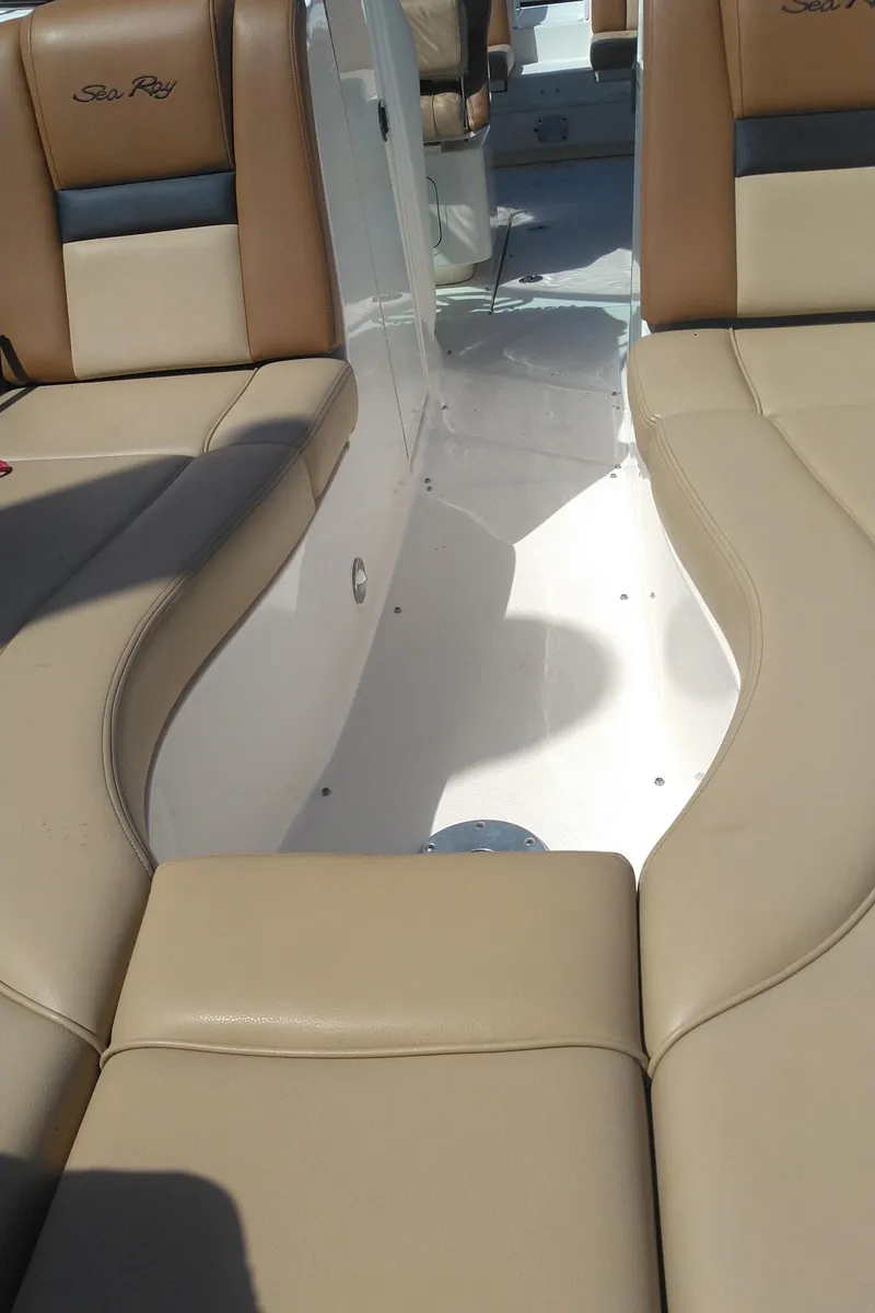 Slide: The Image of 2014 Sea Ray 300 SLX boat interior with beige leather seating. - 25