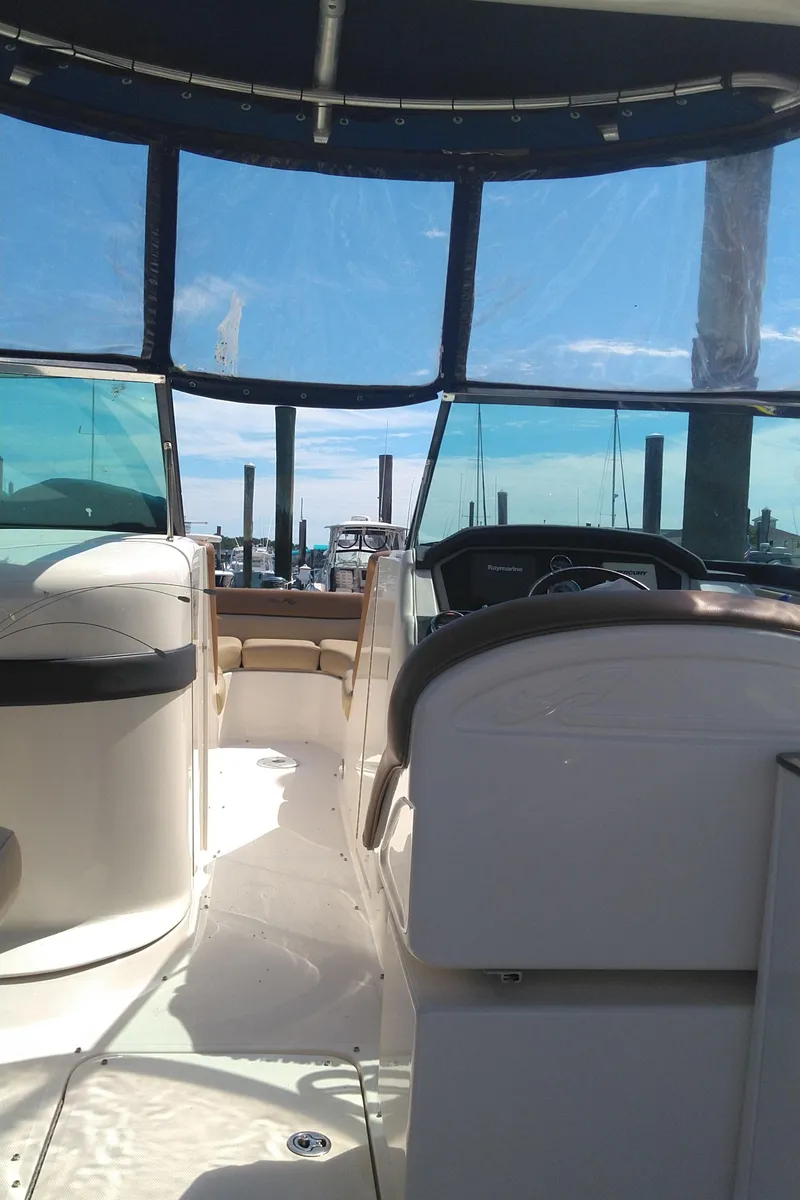 Slide: The Image of 2014 Sea Ray 300 SLX boat interior with clear blue sky view. - 26
