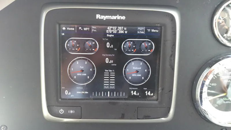 Slide: The Image of Raymarine display on 2014 Sea Ray 300 SLX boat dashboard showing engine metrics. - 29