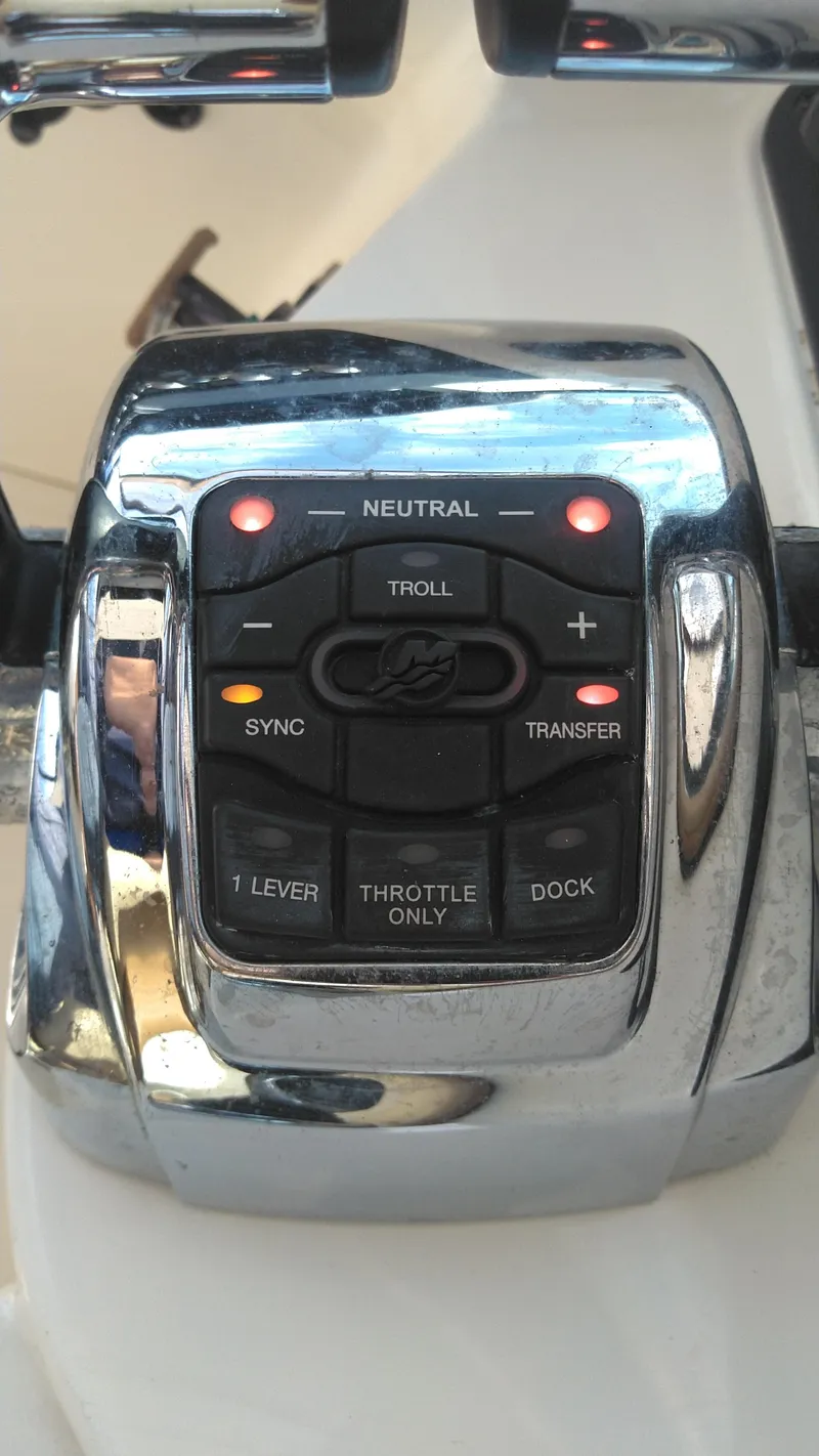 Slide: The Image of 2014 Sea Ray 300 SLX boat control panel with illuminated buttons. - 31