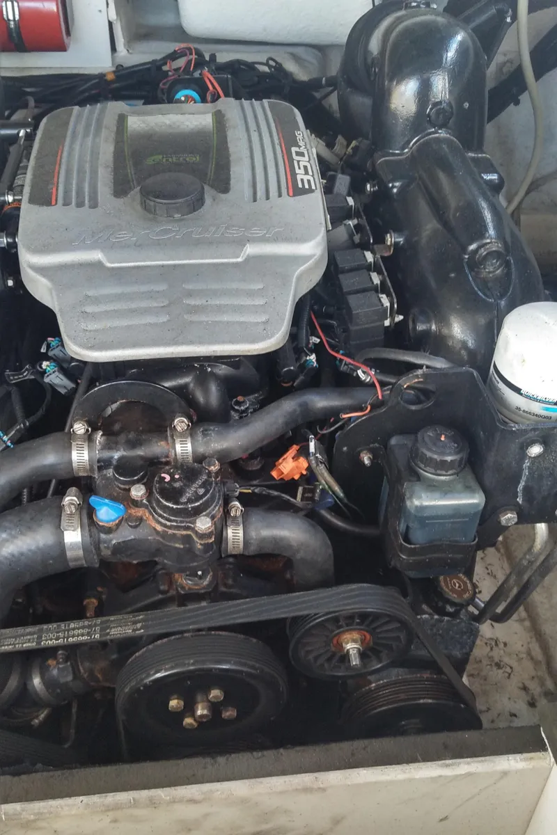 Slide: The Image of 2014 Sea Ray 300 SLX engine compartment, showcasing detailed mechanical components. - 35