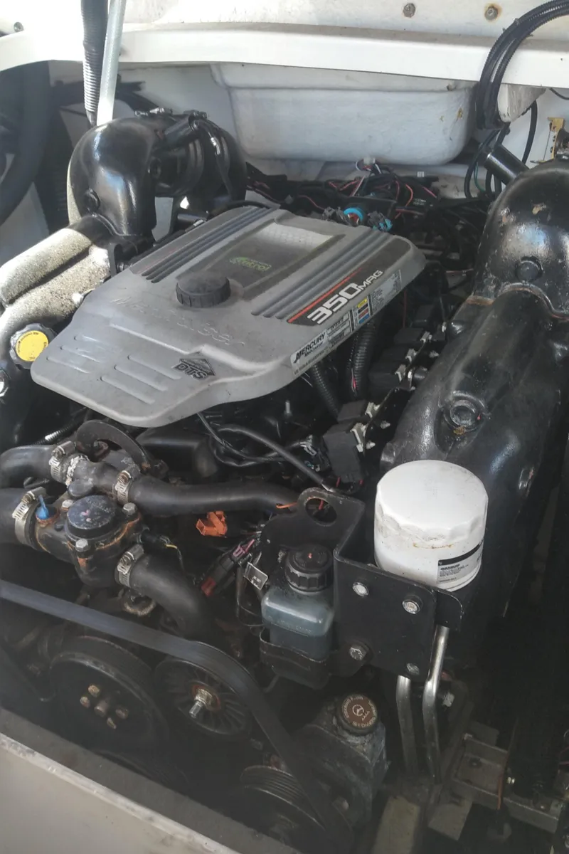 Slide: The Image of 2014 Sea Ray 300 SLX engine compartment, showcasing the powerful 350 MAG engine. - 36