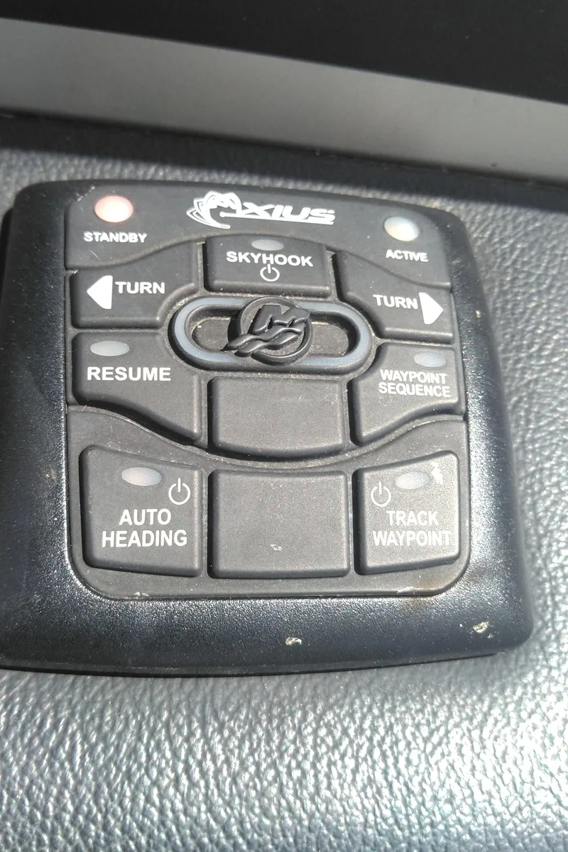 Slide: The Image of Control panel of a 2014 Sea Ray 300 SLX boat with navigation features. - 37