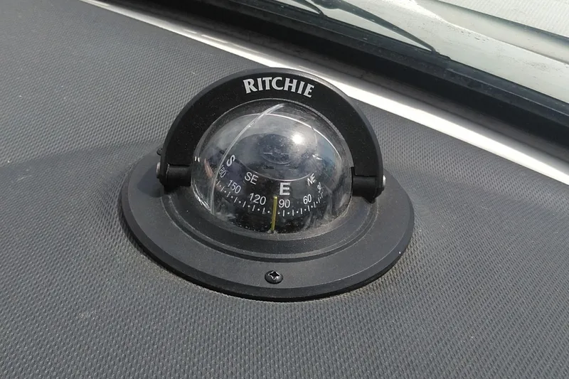 Slide: The Image of Ritchie compass on 2014 Sea Ray 300 SLX dashboard. - 42