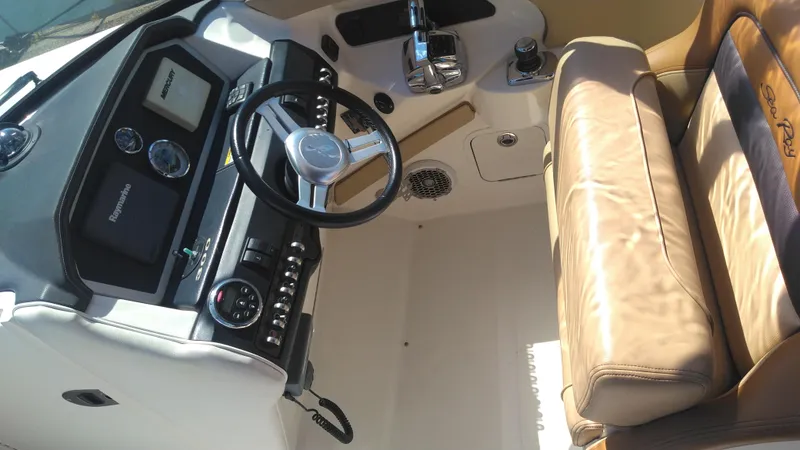 Slide: The Image of Interior of 2014 Sea Ray 300 SLX boat with steering wheel and leather seating. - 7