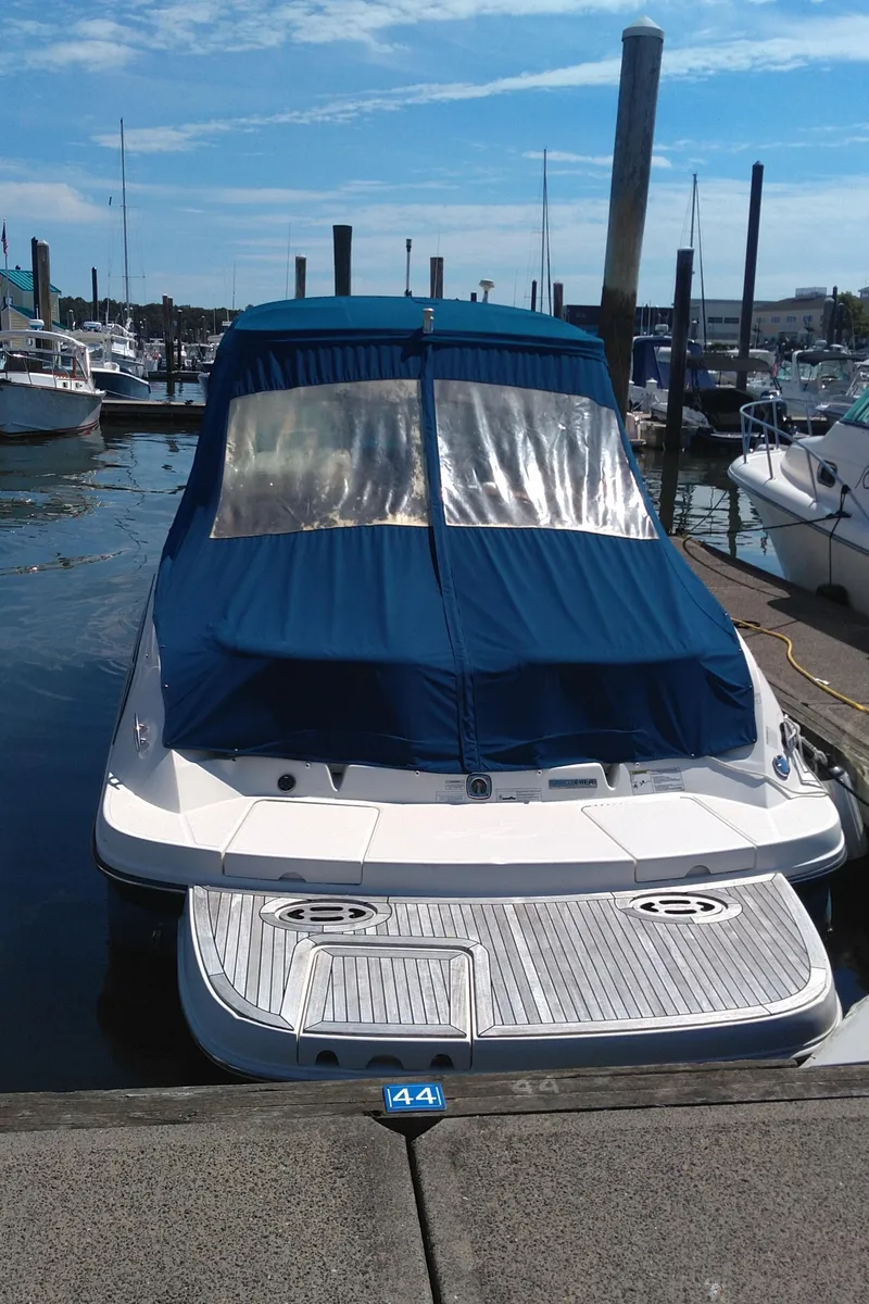 Slide: The Image of 2014 Sea Ray 300 SLX boat docked in marina, blue cover, sunny day. - 8