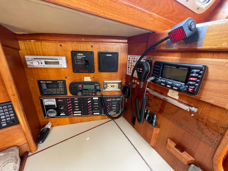 Slide: The Image of Control panel of a 1990 Ericson 38-200 sailboat with navigation and communication equipment. - 16