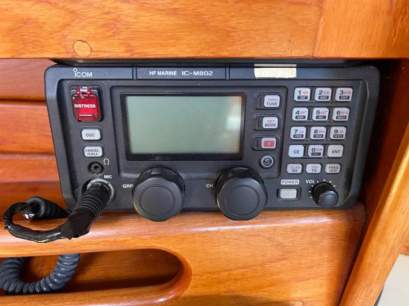 Slide: The Image of Marine radio equipment on Ericson 38-200 yacht, 1990 model, featuring distress button and control knobs. - 17