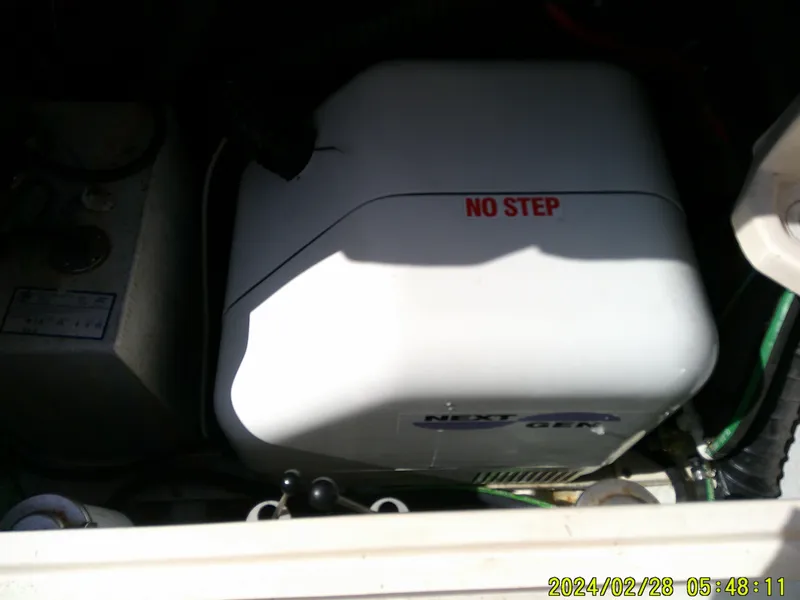 Slide: The Image of Grady-White 330 Express 2013 engine compartment with "No Step" label. - 19