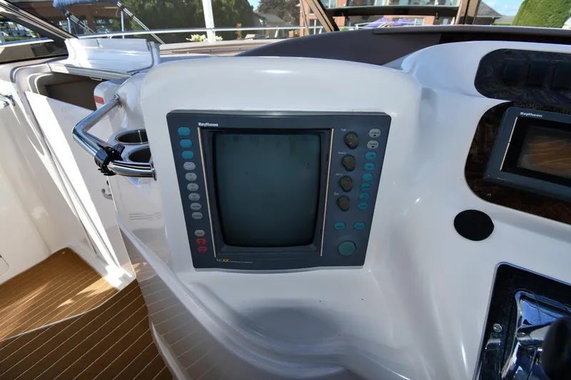 Slide: The Image of Control panel of a 1997 Sea Ray 400 Sundancer boat with navigation display. - 12