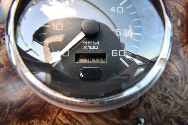 Slide: The Image of Close-up of 1997 Sea Ray 400 Sundancer RPM gauge showing 1011 hours. - 14