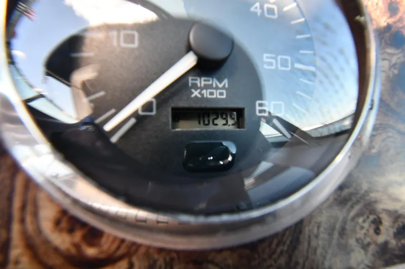 Slide: The Image of Close-up of a 1997 Sea Ray 400 Sundancer RPM gauge displaying 1029.9 RPM. - 15