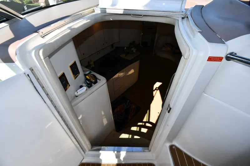 Slide: The Image of 1997 Sea Ray 400 Sundancer cabin entrance, showcasing interior layout and design. - 28