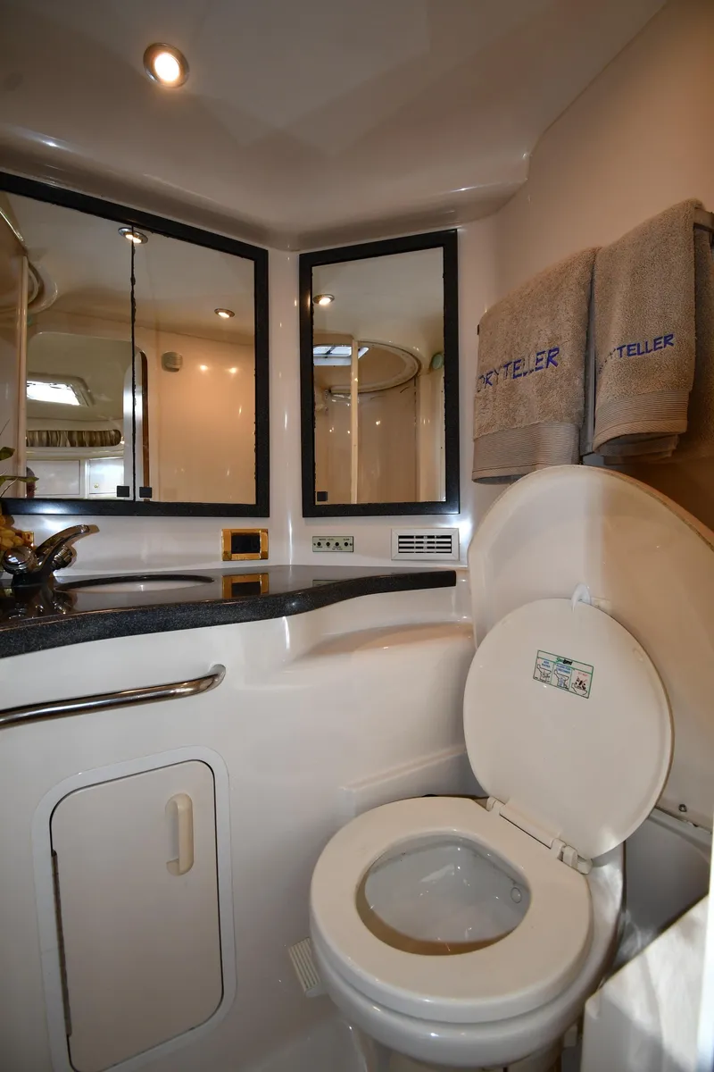 Slide: The Image of Bathroom interior of 1997 Sea Ray 400 Sundancer yacht with modern fixtures and towels. - 36