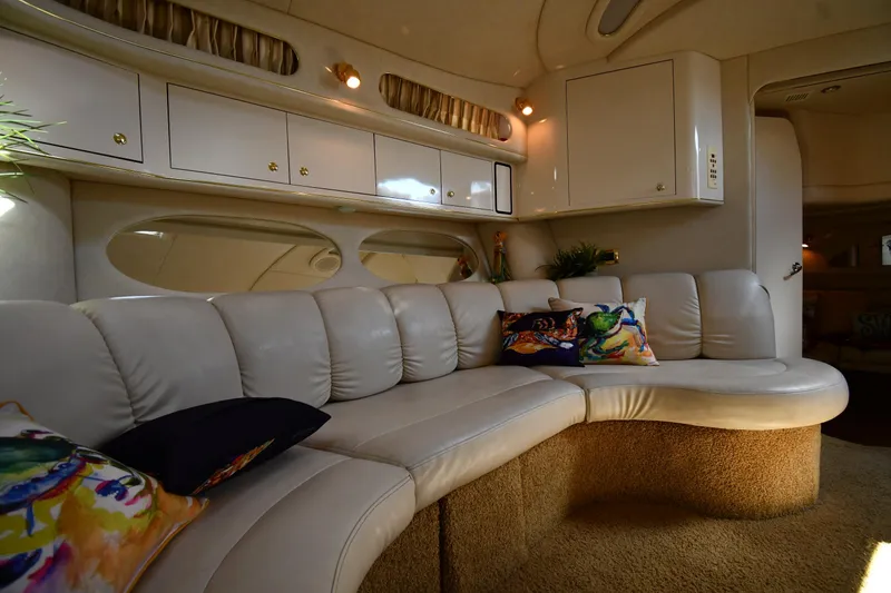 Slide: The Image of Luxurious interior of 1997 Sea Ray 400 Sundancer yacht with plush seating and vibrant cushions. - 45